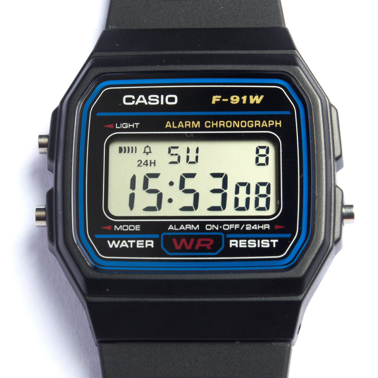 Close-up photograph of a black and blue Casio F-91W digital watch face and part of its resin strap