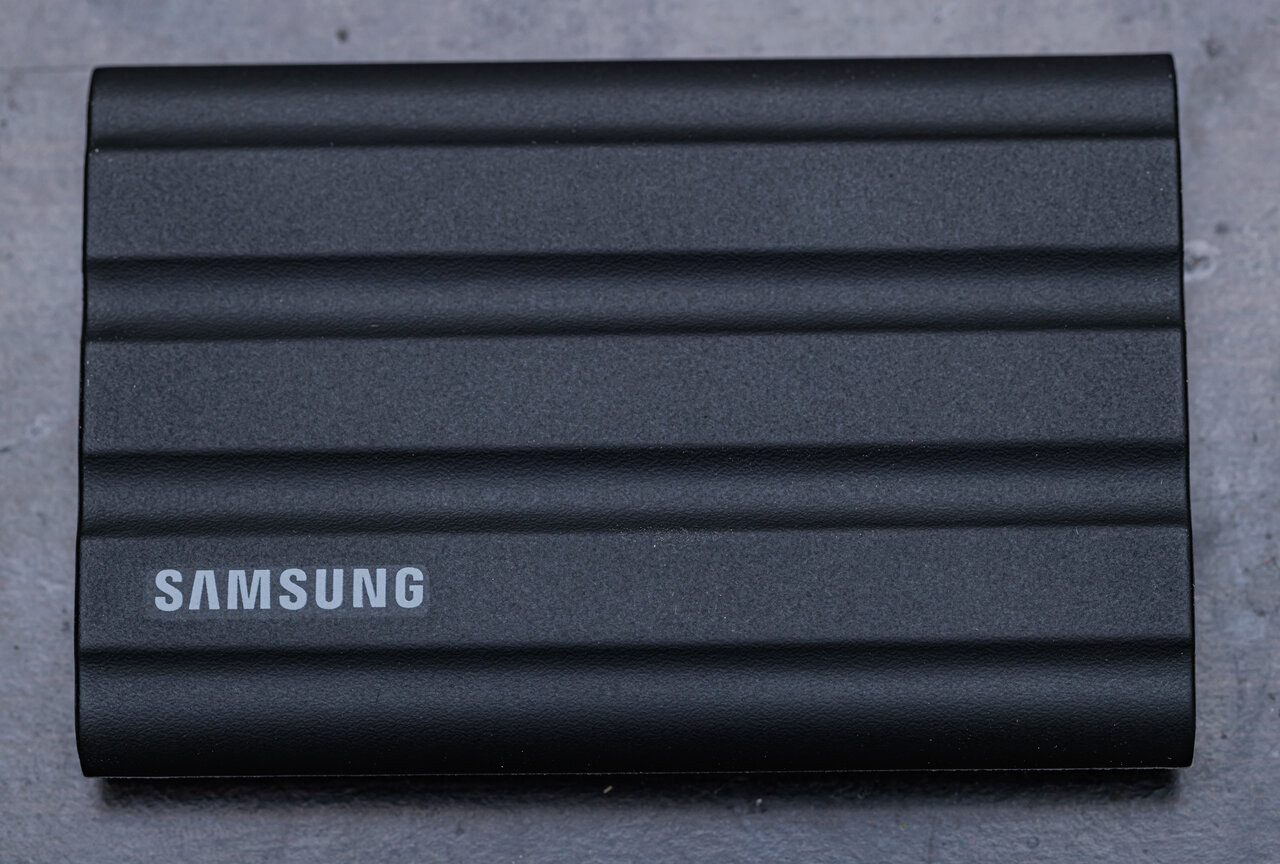 Black Samsung T7 Shield 4TB portable SSD photographed from the front with its ribbed exterior visible